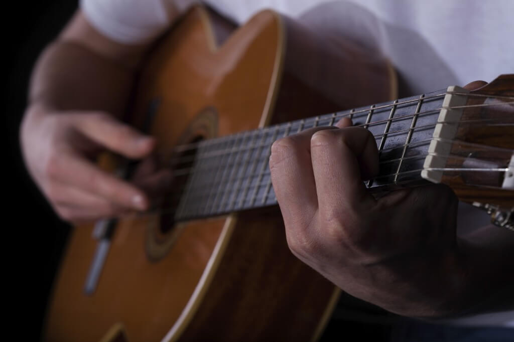 Man playing on guitar