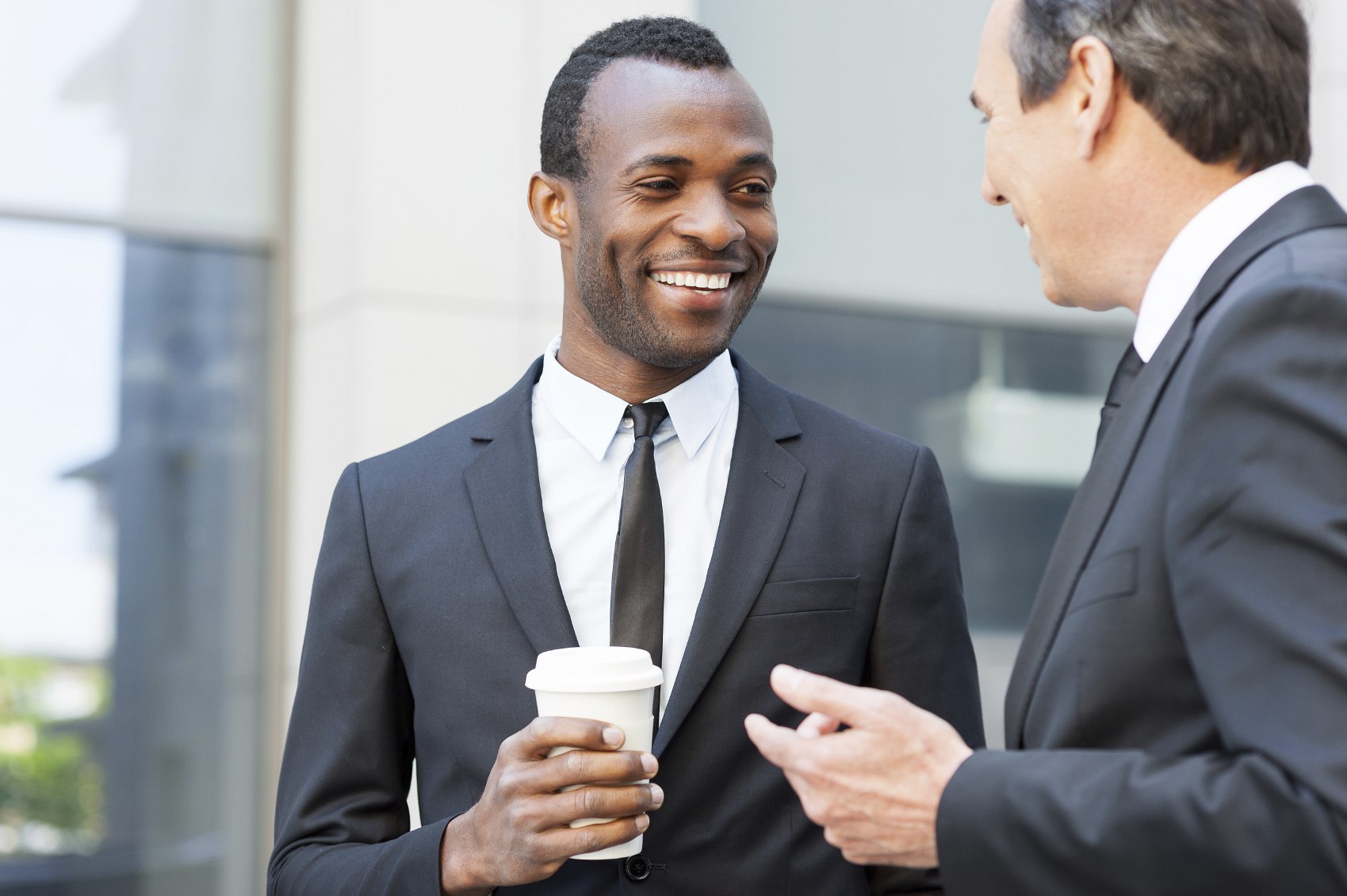 Office Workers Talking During Coffee Break