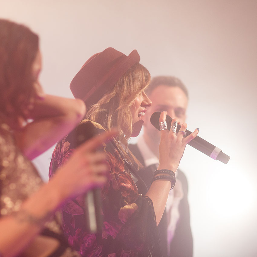 Female vocalist performing solo.